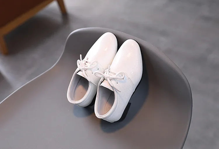 Dressy black boys' shoes for special occasions and reliable school footwear.