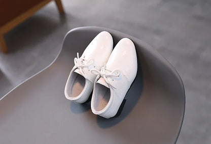 Dressy black boys' shoes for special occasions and reliable school footwear.