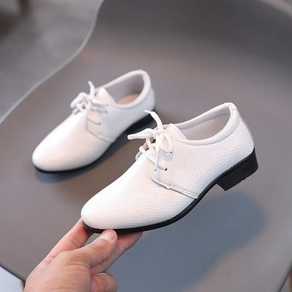 Classic black boys' dress shoes, perfect for formal events and school wear.