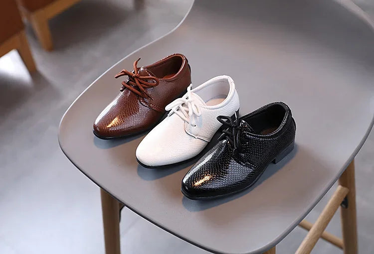 School uniform black PU leather shoes for boys, a staple for everyday wear.