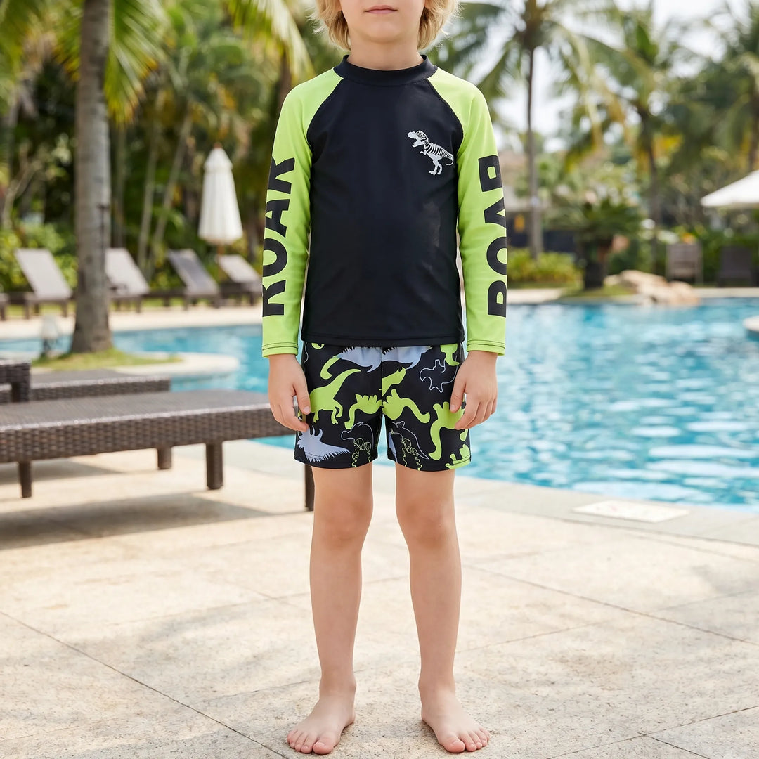 Boys' long-sleeve dinosaur rash guard swimsuit set, perfect for sun protection at the beach or pool.