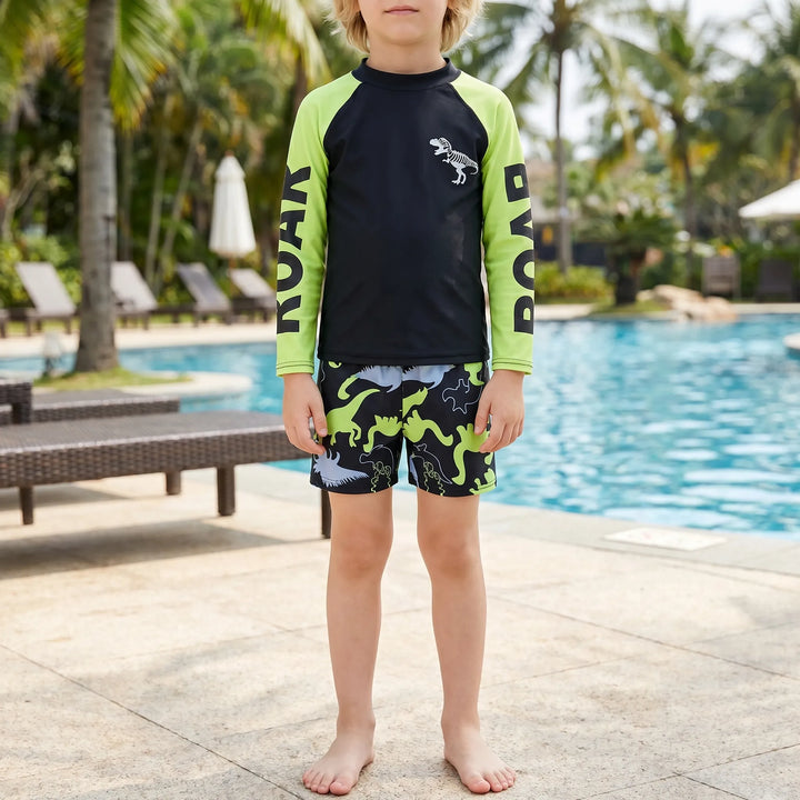 Boys' long-sleeve dinosaur rash guard swimsuit set, perfect for sun protection at the beach or pool.