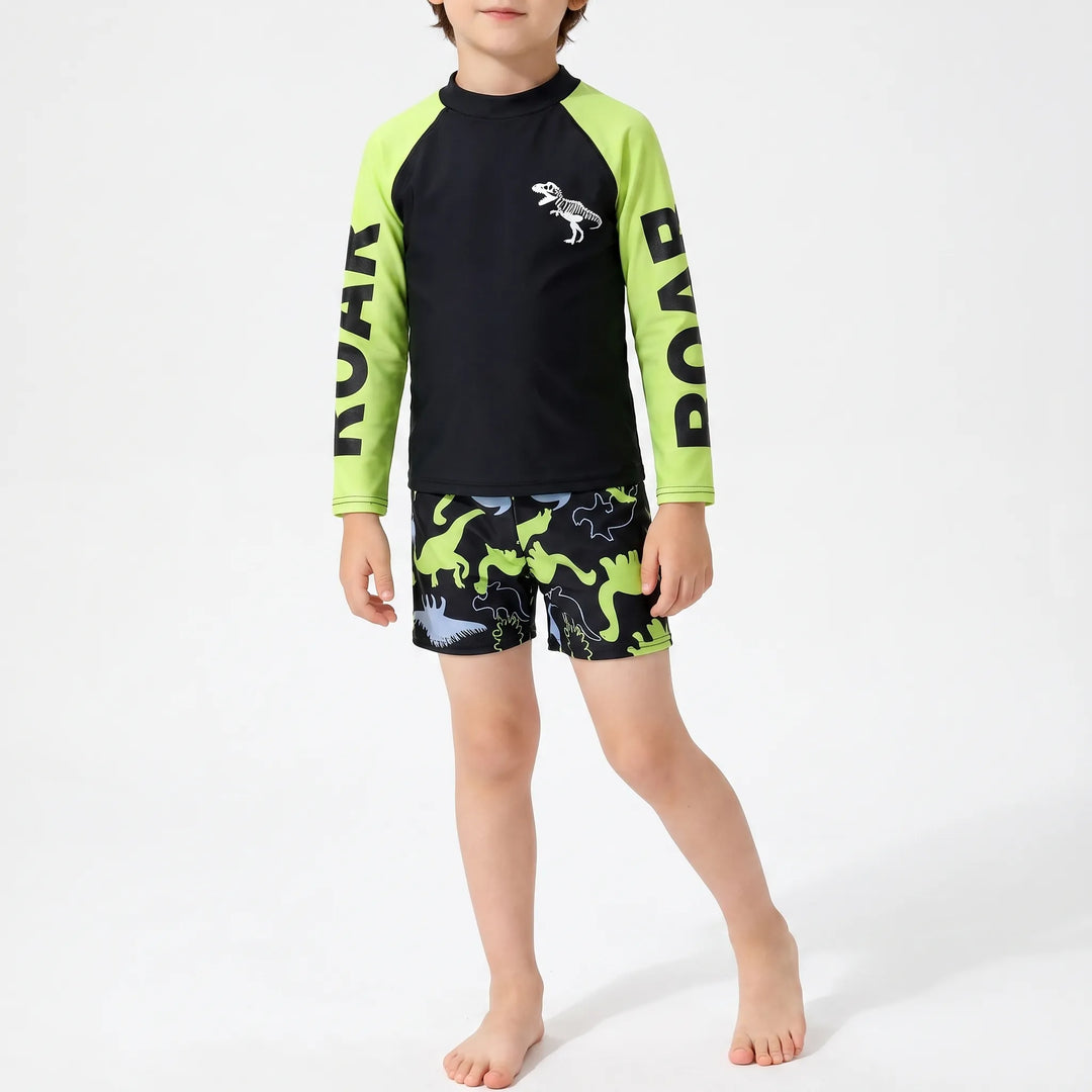 Vibrant two-piece boys' dinosaur swimsuit set, a fun long-sleeve rash guard for summer activewear.