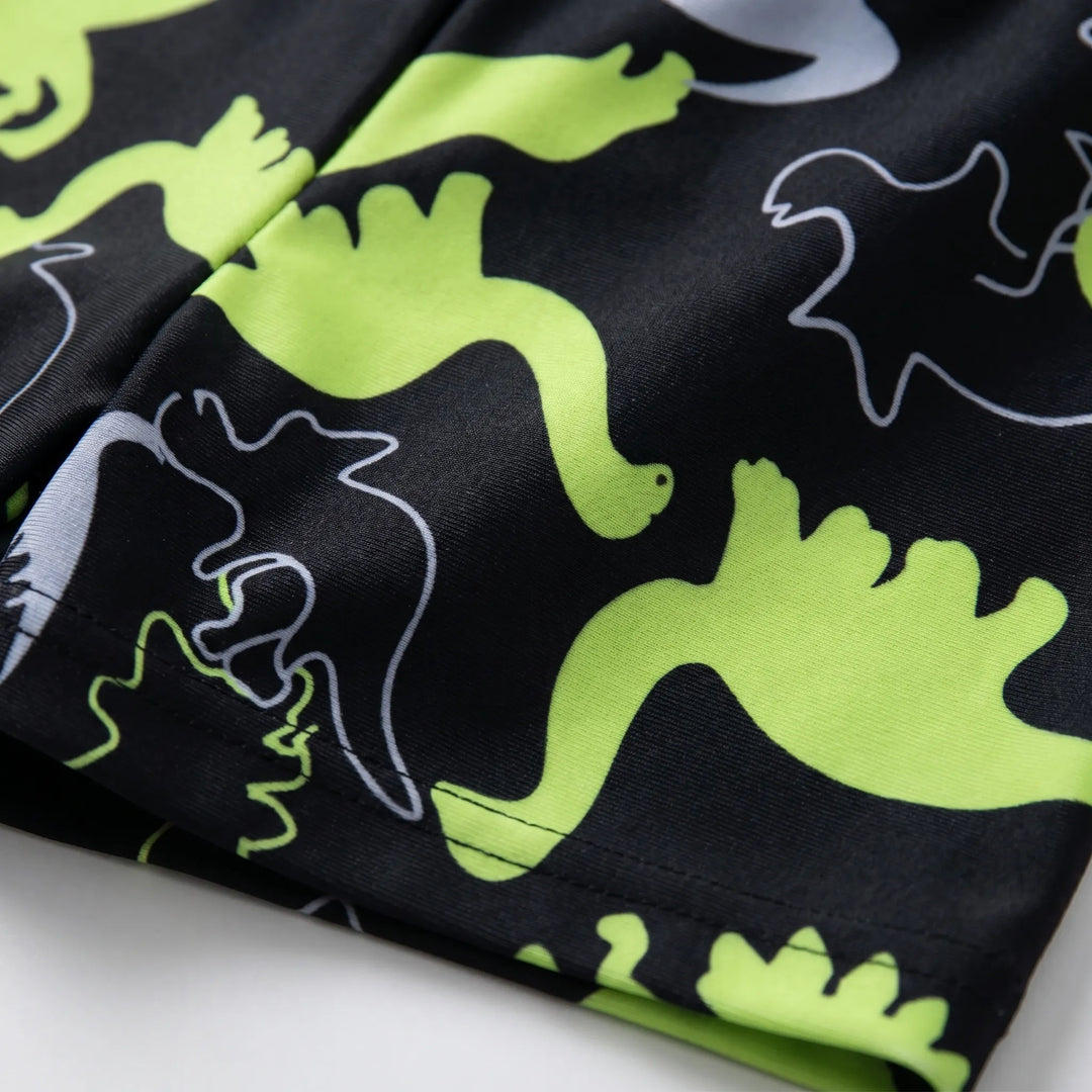Children's long-sleeve dinosaur swimwear set, providing sun protection for youth beachwear and pool days.