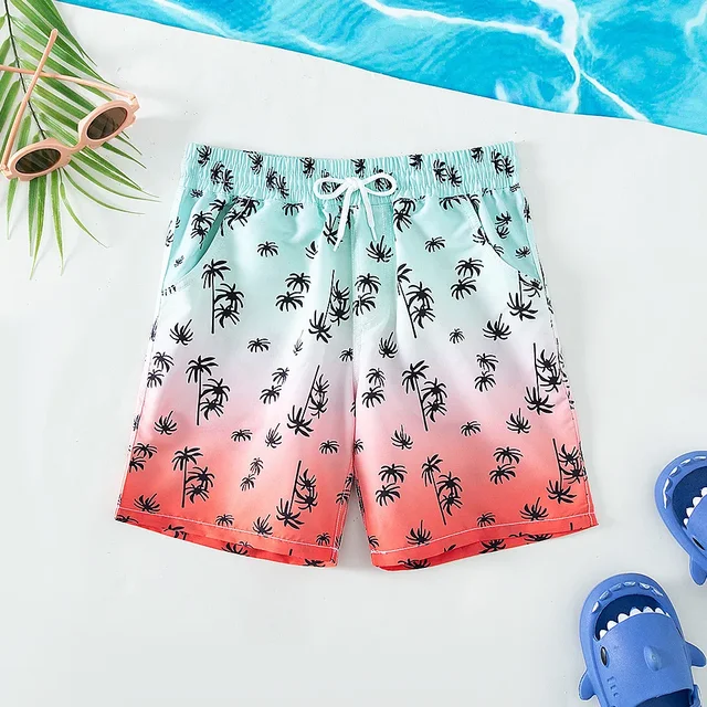 Boys' quick dry nylon shorts in green, comfortable swimwear for active kids.