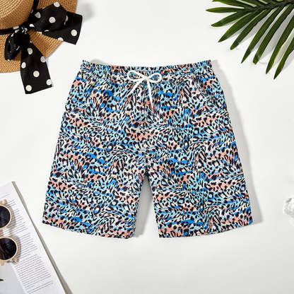 A pair of quick-dry swim trunks for boys, demonstrating the soft inner lining feature.