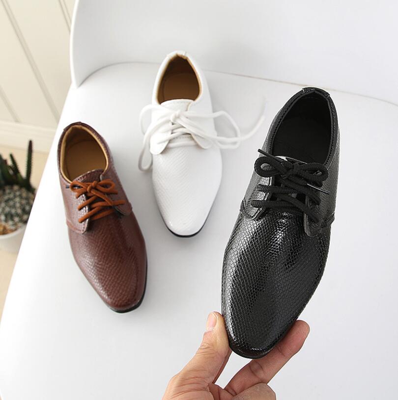 Boys' slip-on dress shoes, black crocodile print leather, formal & comfortable.