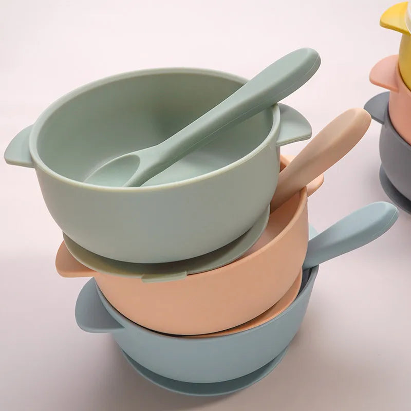 Green BPA-free silicone baby feeding bowl with lid & spoon, durable and safe dinnerware for toddlers