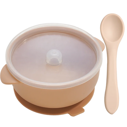 BPA-free silicone baby feeding bowl with a strong suction base preventing spills, in a modern kitchen setting