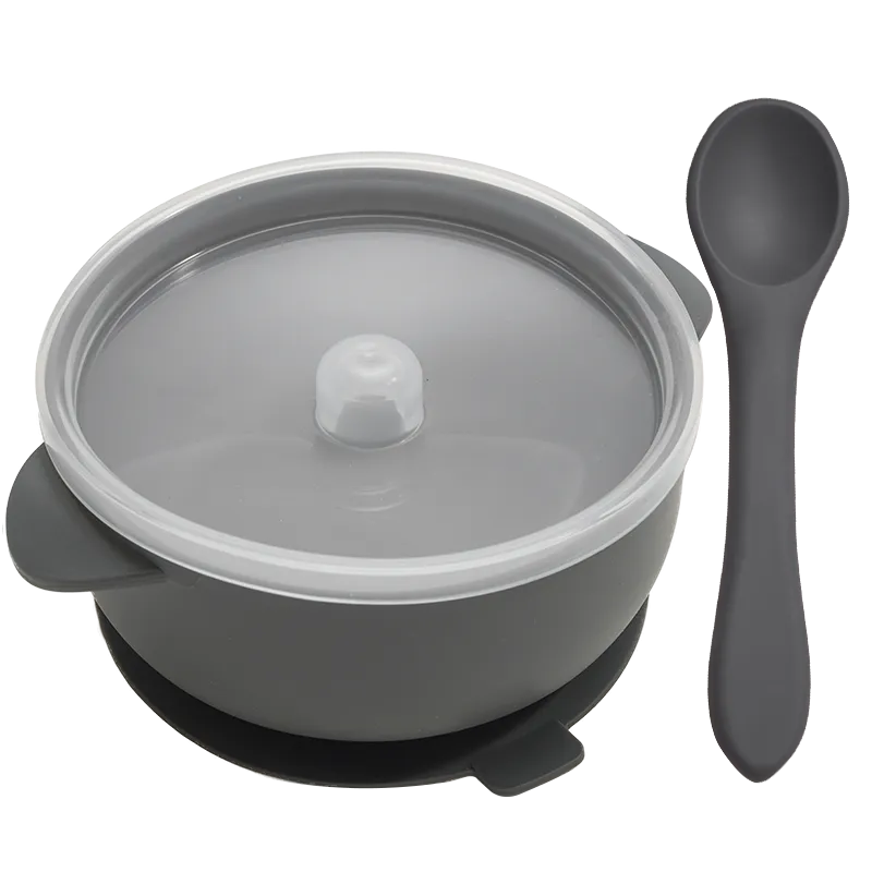 Top-down view of a complete BPA-free silicone baby feeding set: bowl, lid, and spoon, neatly arranged
