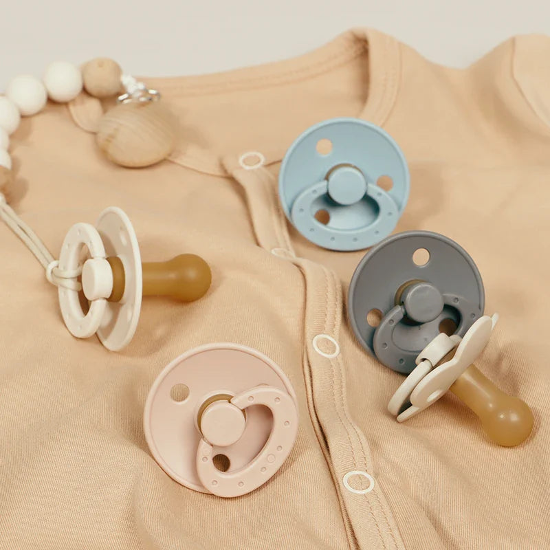 BPA-free silicone baby pacifier, round nipple, soft pink, newborn essential