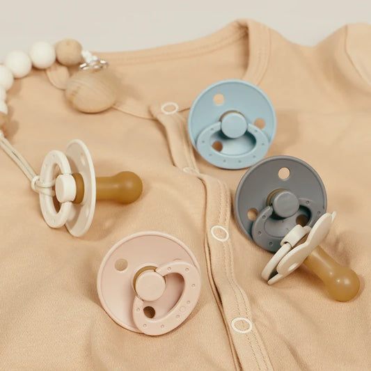 BPA-free silicone baby pacifier, round nipple, soft pink, newborn essential