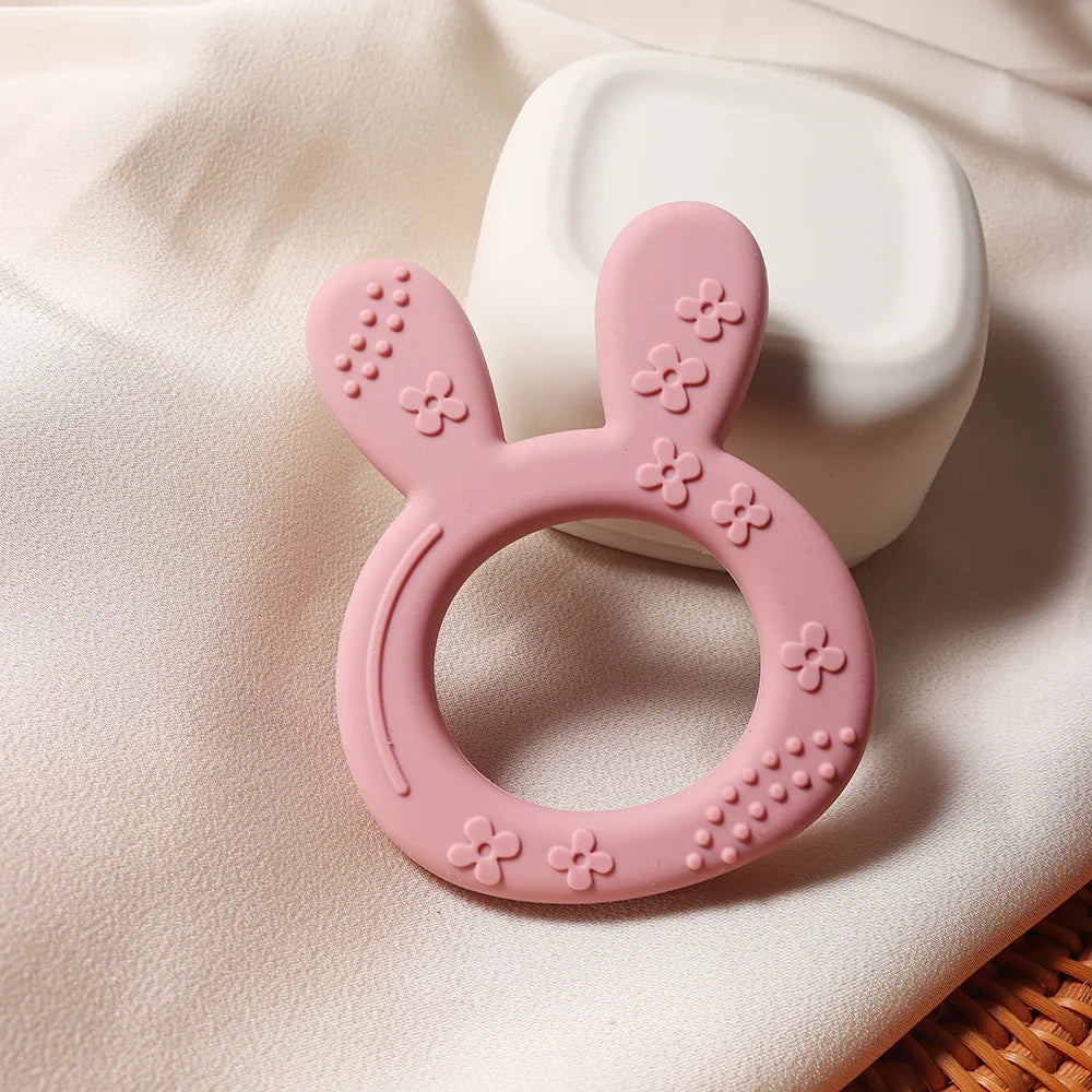 Playful carrot bunny silicone teether, a must-have BPA-free infant toy that offers effective teething relief
