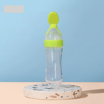 Safe and easy-to-use baby feeder bottle with a silicone spoon for mess-free meal times