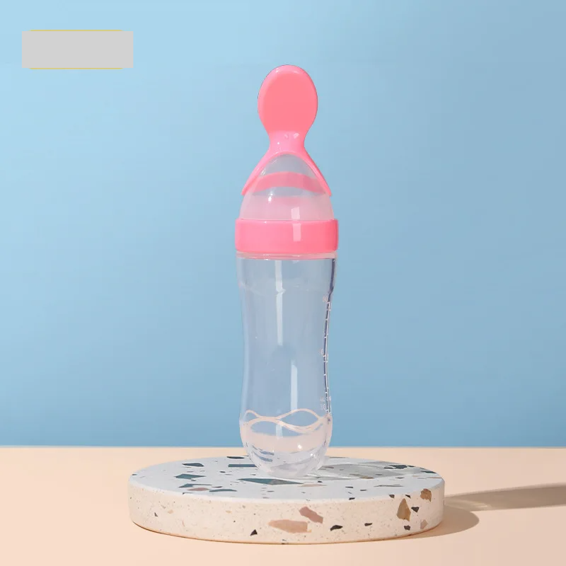 Weaning aid baby feeder with soft silicone spoon for purees, promoting self-feeding skills