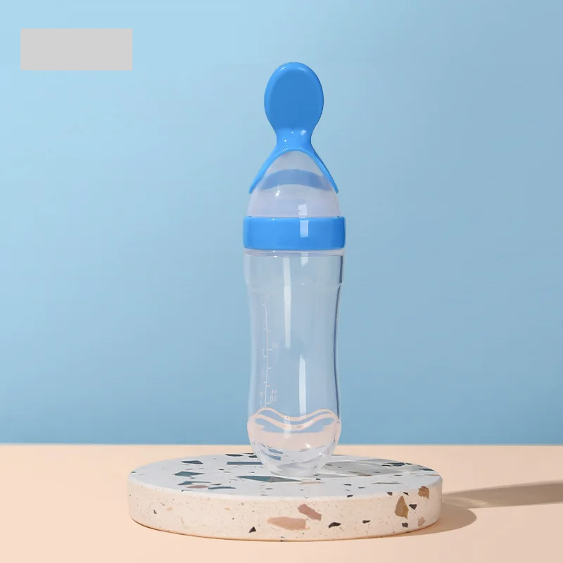 Portable baby essentials: BPA-free silicone feeder bottle and spoon for on-the-go weaning