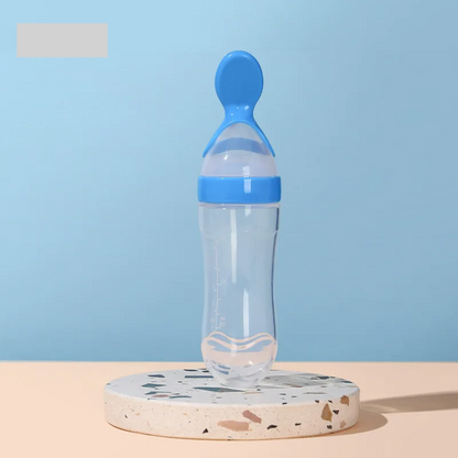 Portable baby essentials: BPA-free silicone feeder bottle and spoon for on-the-go weaning