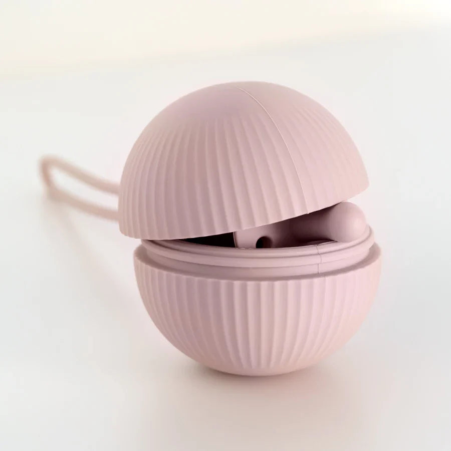 Three colorful BPA-free silicone pacifier storage boxes in pink, blue, and green, essential baby travel accessories