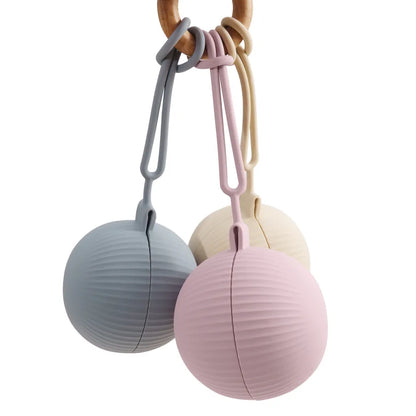 White background shot of a single green BPA-free silicone pacifier case, emphasizing its clean and simple design