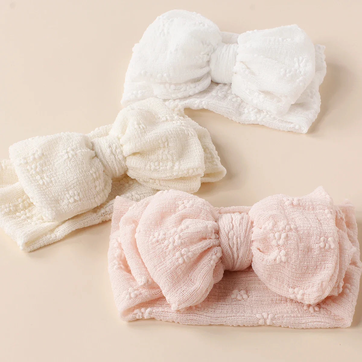 Two cute baby breathable double bow turban headbands in pink and white, mesh fabric.