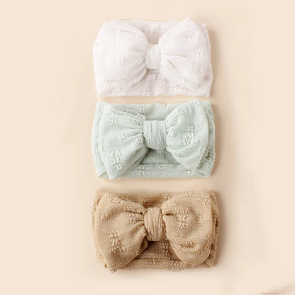 Unisex baby breathable mesh double bow turban headband, soft and comfortable for newborns.