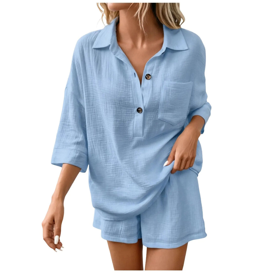 Women's two-piece casual resort wear: collared top & drawstring beach shorts for a relaxed summer look.