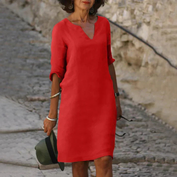 Women's casual V-neck midi dress, embodying breezy summer fashion and relaxed elegance.