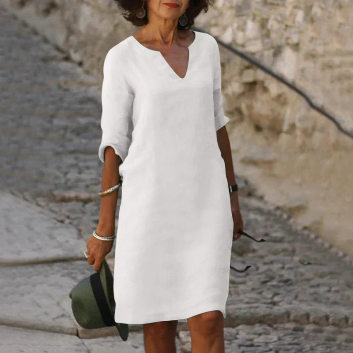 Elegant women's summer midi dress with V-neck, offering comfortable and versatile style.