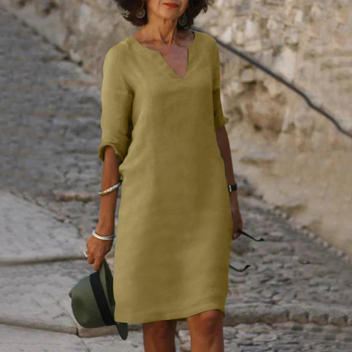 Comfortable women's V-neck midi dress, perfect for warm weather and relaxed summer elegance.