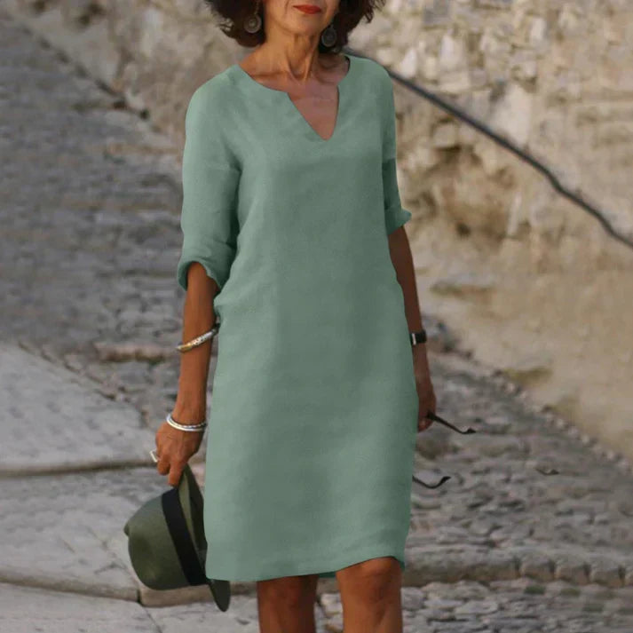 Relaxed fit V-neck midi dress, a summer essential for women seeking comfort and style.