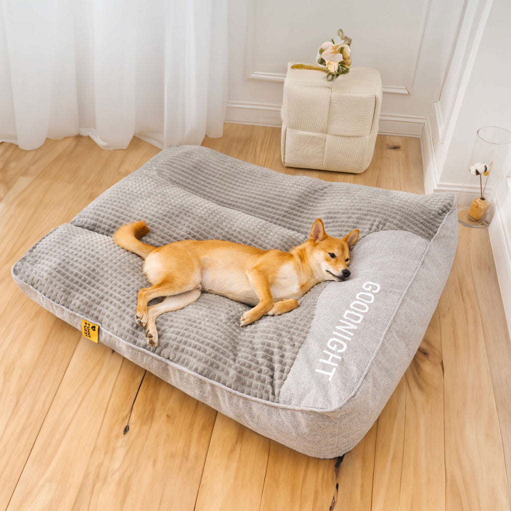 Gray orthopedic pet bed with supportive cushion, offering joint support & comfort for large dogs. Durable & tear-resistant.