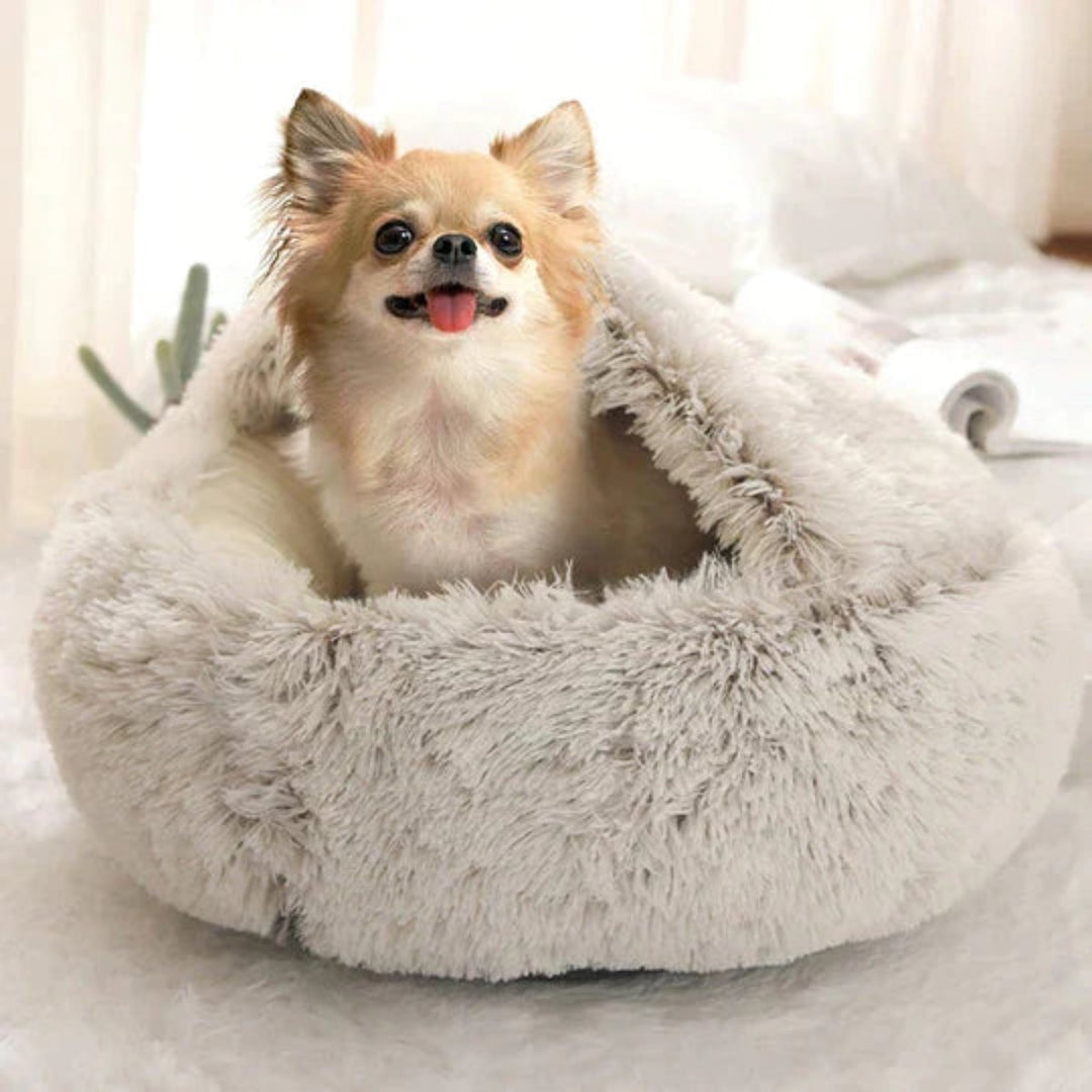 Soft, round calming dog bed. This cozy cave offers stress relief & deep relaxation for anxious pets.