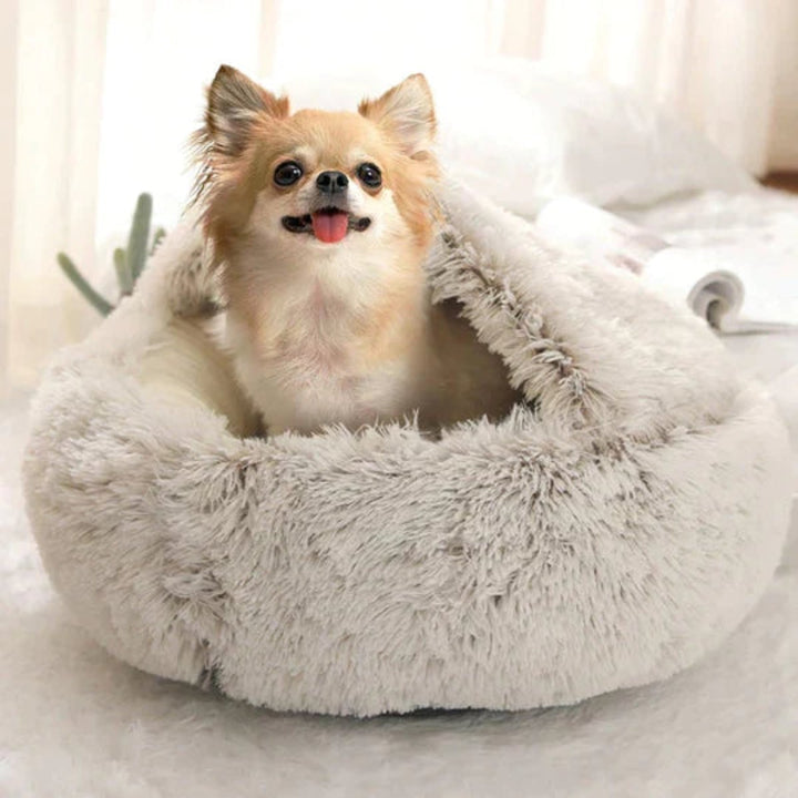 Soft, round calming dog bed. This cozy cave offers stress relief & deep relaxation for anxious pets.
