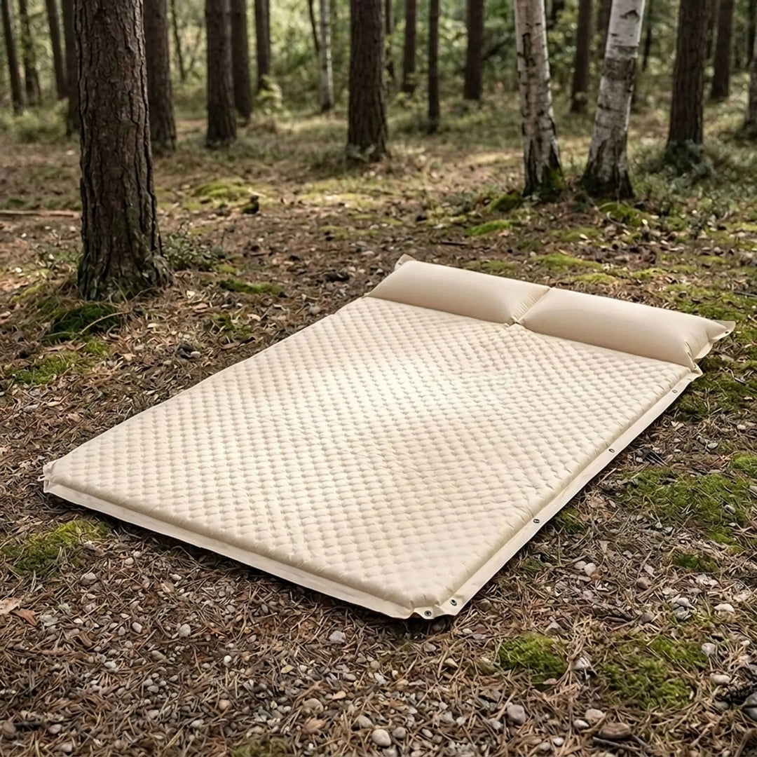 Camping sleeping pad with pillow, self-inflating for outdoor comfort, portable and lightweight travel gear.