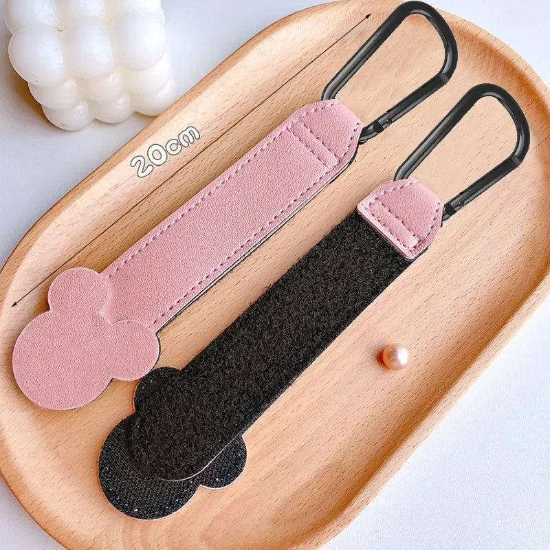 Set of two rotatable cartoon PU leather stroller hooks, ideal for organizing baby essentials