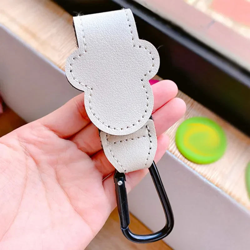 Stroller accessory: Rotatable cartoon PU leather hook, perfect for hanging diaper bags & toys