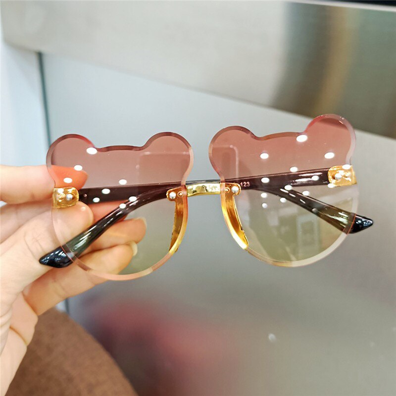 Green cartoon UV protection sunglasses, a vibrant accessory for active boys and girls outdoors