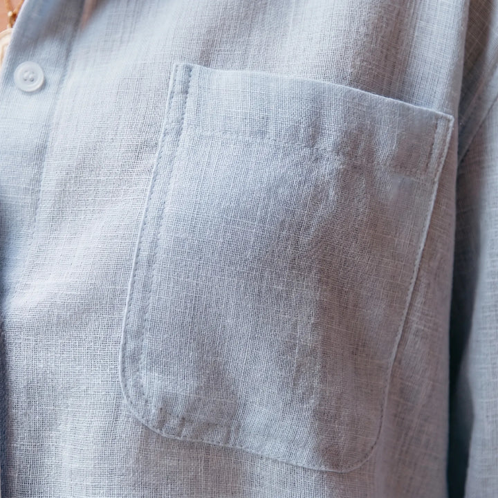 Stylish women's long-sleeved button-up blouse with collar, a versatile casual top for any occasion.