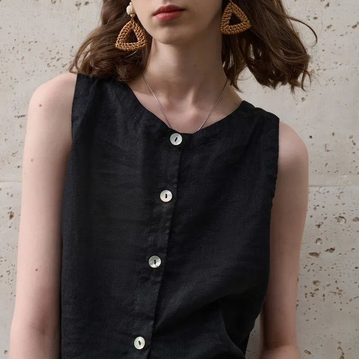 Soft pink women's sleeveless asymmetric crop top. Comfortable & relaxed fit, great for everyday summer fashion.