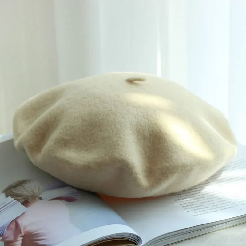 Chic red women's winter beret hat, classic style warm headwear fashion accessory.