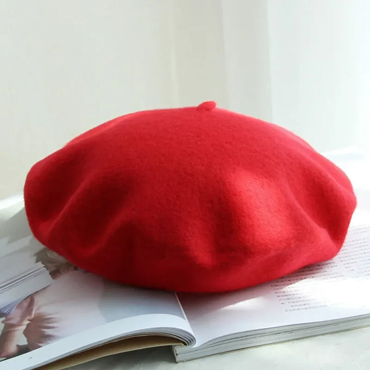 Classic women's beret in various colors, stylish and warm winter hat fashion accessory.