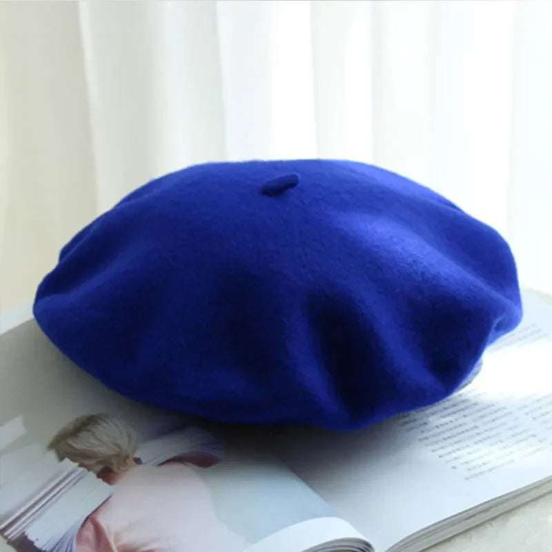 Classic navy blue women's beret, a chic and warm winter hat fashion accessory.