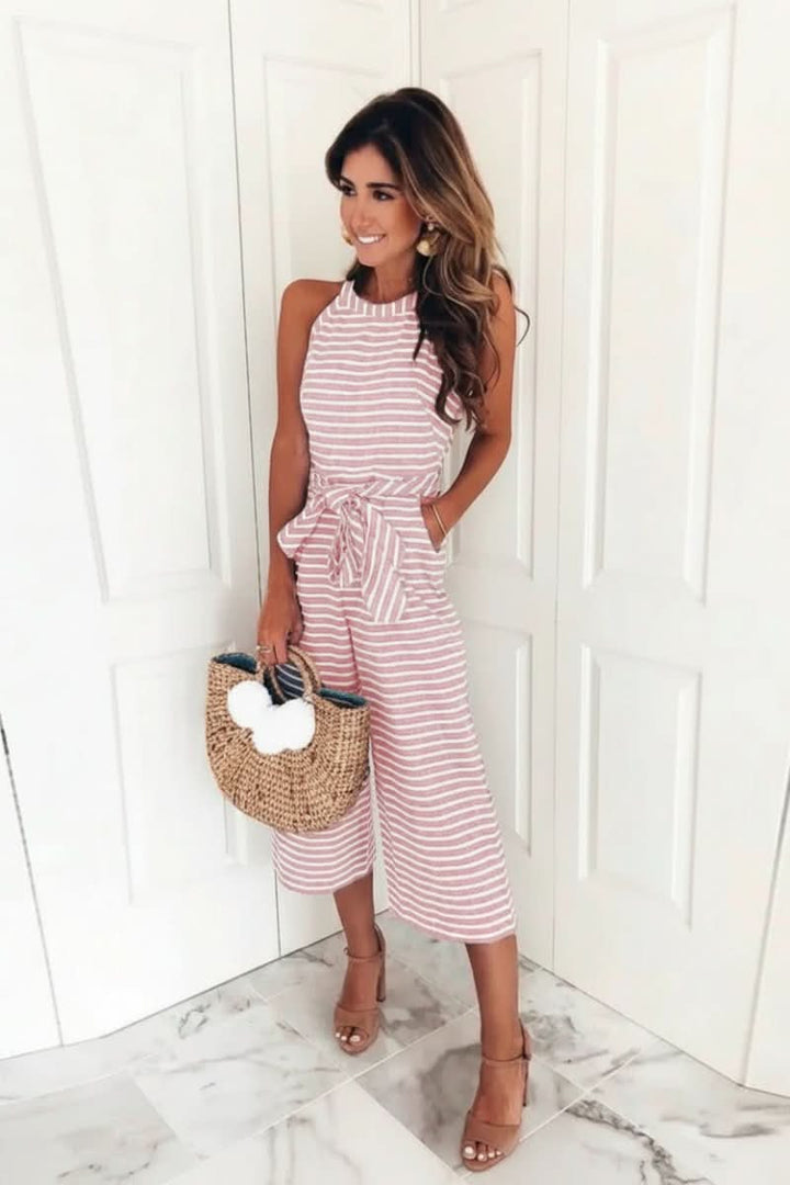 Chic striped belted women's jumpsuit with halter neck. Effortless one-piece for versatile modern style.