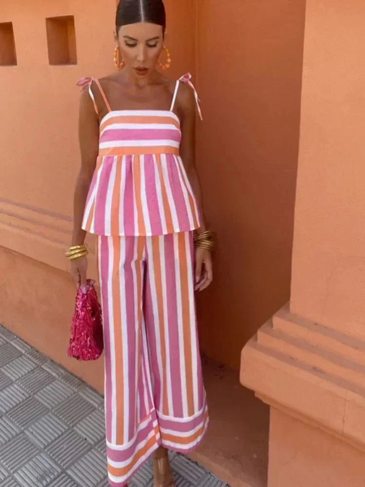Women's striped wide leg pant set with a stylish peplum top, ideal for summer special occasions or vacation.