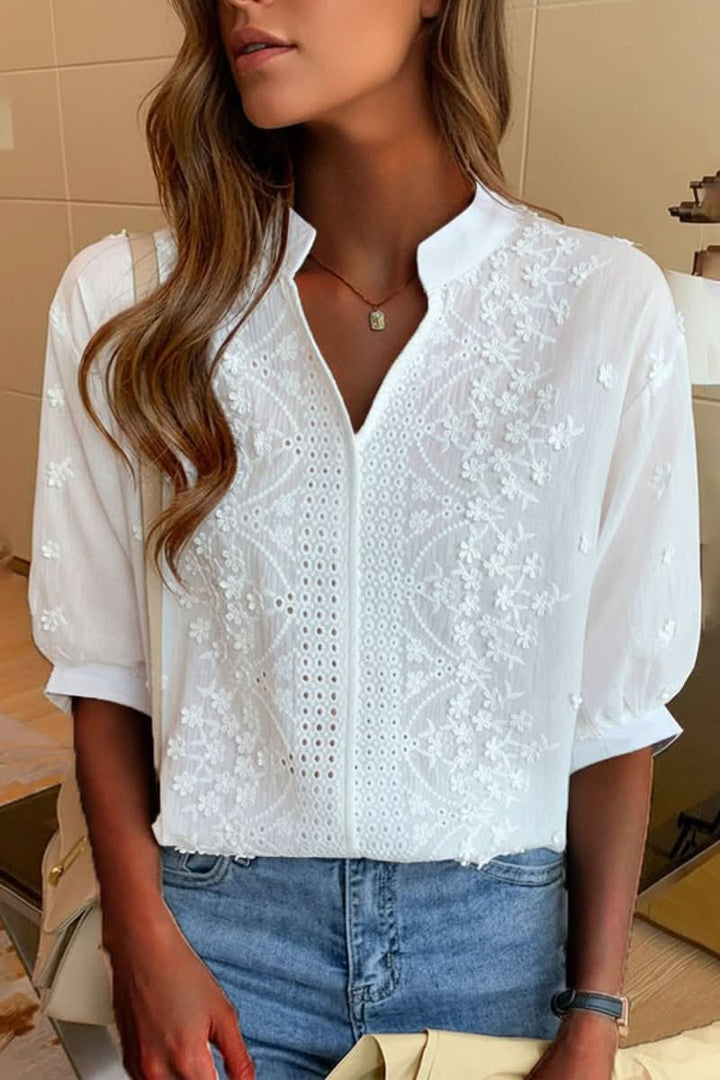 Chic V-neck elegant women's top. Versatile short-sleeve blouse for casual, office, or evening wear. Comfortable summer style.
