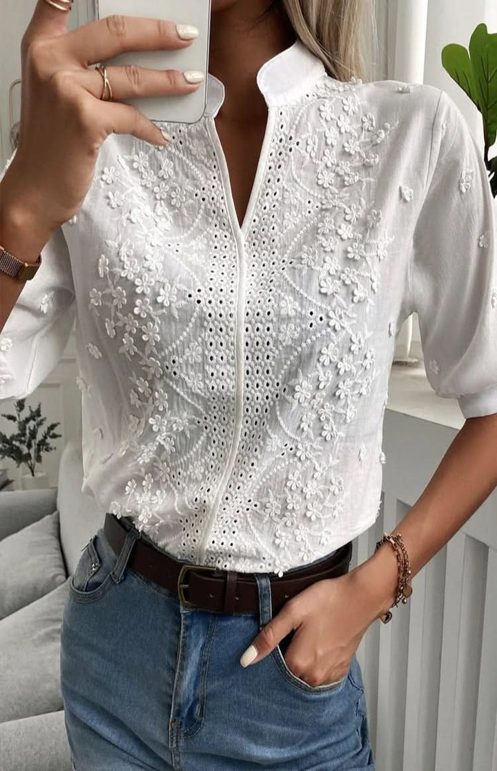 Chic V-neck women's elegant top. A versatile short-sleeve blouse, great for dressing up or down in summer.