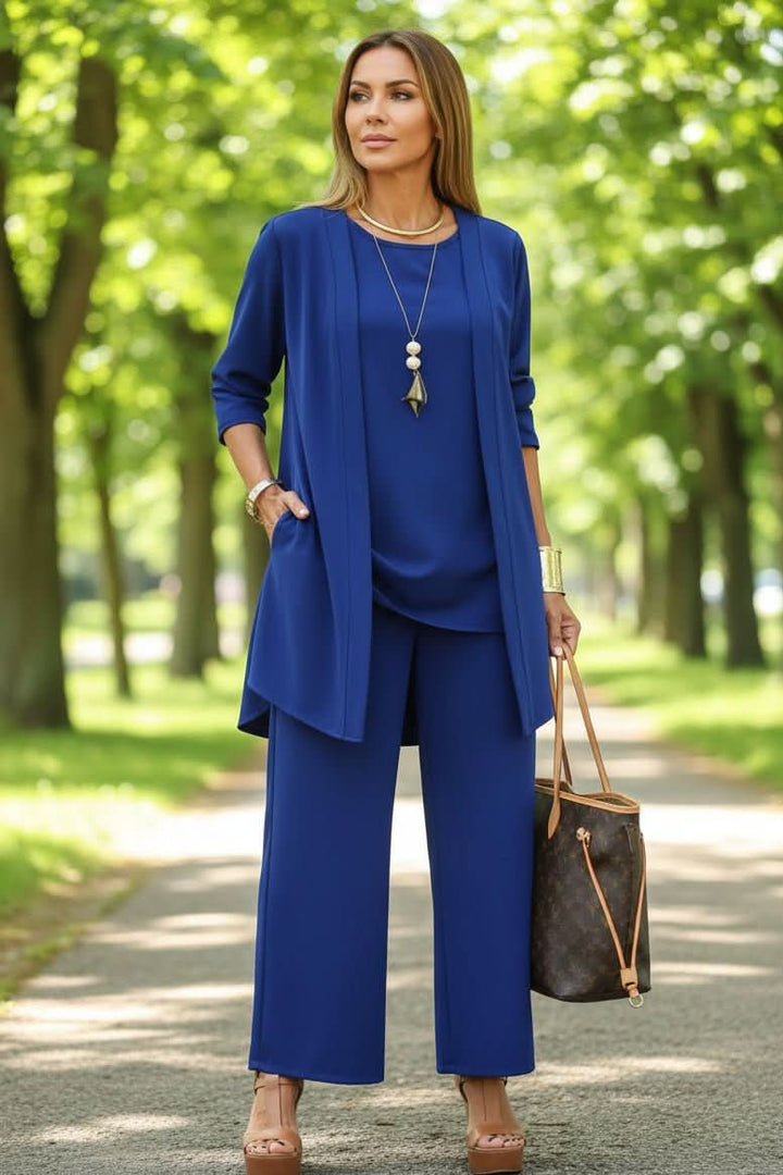 Model wearing a chic women's 3-piece summer loungewear set, featuring flowy pants, perfect for a casual day.