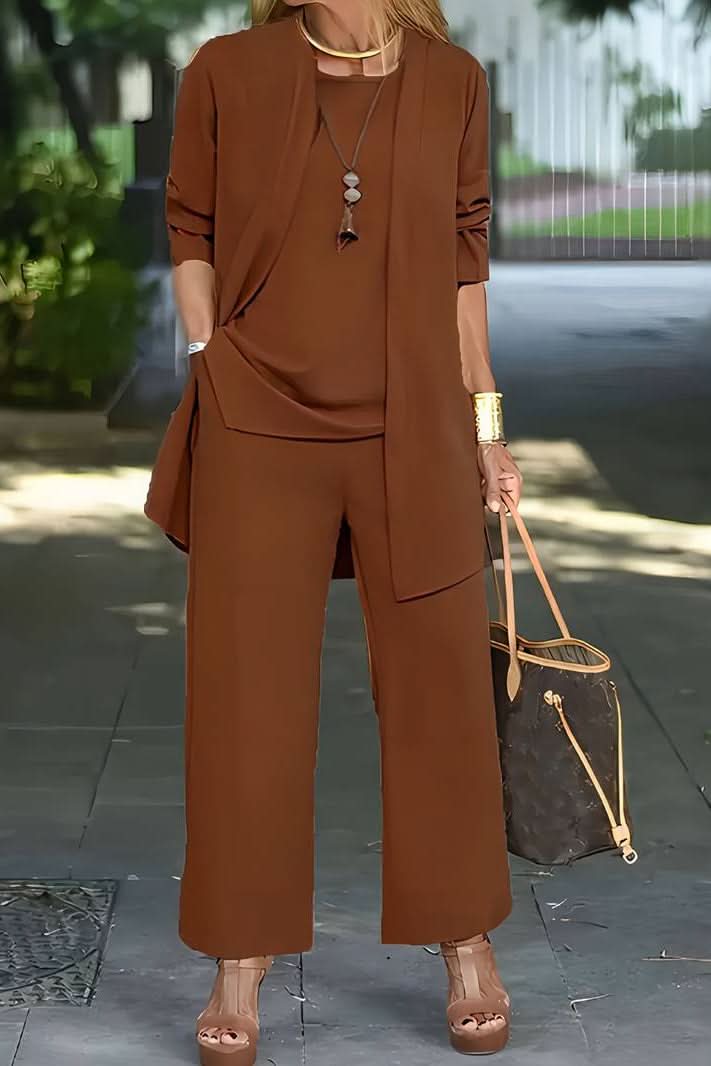 Woman relaxing in a chic 3-piece summer lounge set, featuring flowy pants, ideal for resort or beach wear.