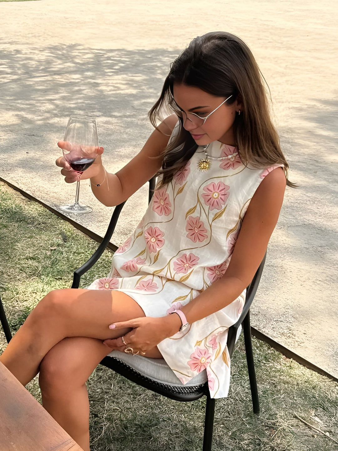 Chic women's A-line mini dress with a vibrant floral print and elegant mock neck, perfect for summer parties.