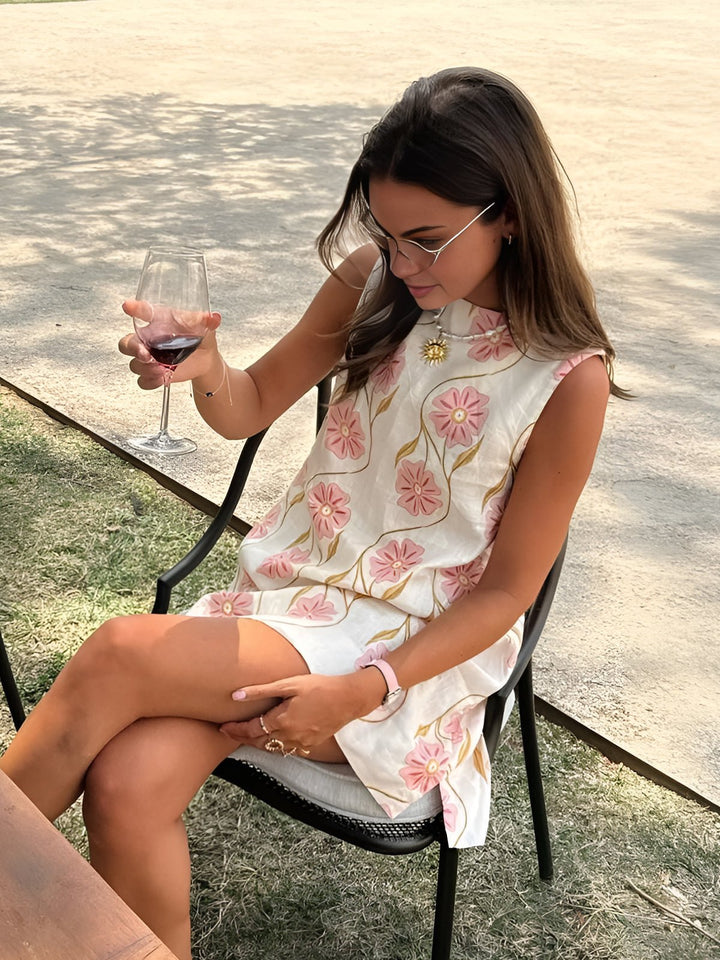 Chic women's A-line mini dress with a vibrant floral print and elegant mock neck, perfect for summer parties.